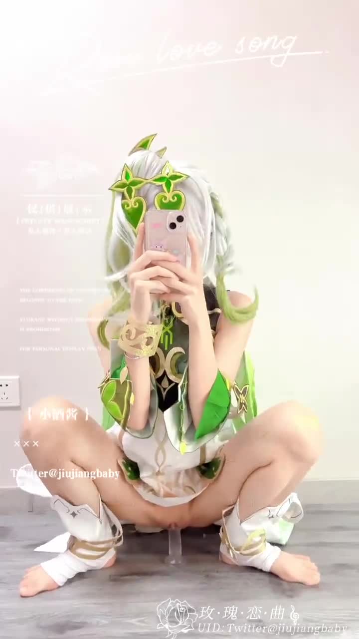 nahida (genshin impact), genshin impact, real life, animated, artist  request, audible music, highres, photo (medium), sound, tagme, video,  1girl, cellphone, cosplay, dildo, dildo riding, feet, female focus, green  hair, interior, masturbation, medium